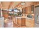 Open concept kitchen with an island and updated appliances at 1774 Upper Bear Creek Rd, Evergreen, CO 80439