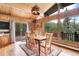 Cozy dining area with wooden table and chairs, enjoying natural light and scenic views at 1774 Upper Bear Creek Rd, Evergreen, CO 80439