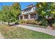 Two-story house with front porch and well-maintained landscaping at 8537 E 35Th Ave, Denver, CO 80238