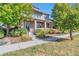 Two-story house with front porch and nicely landscaped yard at 8537 E 35Th Ave, Denver, CO 80238