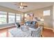 Bright and airy living room with hardwood floors and large windows at 8537 E 35Th Ave, Denver, CO 80238