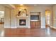 Spacious living room with a fireplace and built-in entertainment center at 8537 E 35Th Ave, Denver, CO 80238