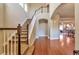 Elegant entryway with hardwood floors and a staircase leading upstairs at 8537 E 35Th Ave, Denver, CO 80238