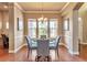 Elegant dining room with hardwood floors and a charming chandelier at 8537 E 35Th Ave, Denver, CO 80238