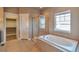 Large bathroom with soaking tub, walk-in shower, and double vanity at 8537 E 35Th Ave, Denver, CO 80238