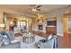 Open concept living area with hardwood floors, a fireplace, and built-in entertainment center at 8537 E 35Th Ave, Denver, CO 80238