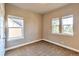 Bright bedroom with carpet flooring and two large windows at 8537 E 35Th Ave, Denver, CO 80238