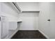 Spacious walk-in closet with hanging rods and shelving at 1601 Park Ave # 216, Denver, CO 80218