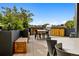 Shared rooftop deck with seating, grill, and city views at 1601 Park Ave # 216, Denver, CO 80218
