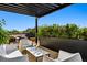 Rooftop patio features comfortable seating and a pergola for shade at 1601 Park Ave # 216, Denver, CO 80218