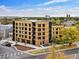 Modern apartment building with wood and metal accents, situated in a vibrant urban setting at 1601 Park Ave # 216, Denver, CO 80218