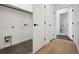 Bright laundry room with ample storage and floor-to-ceiling cabinets at 1601 Park Ave # 216, Denver, CO 80218
