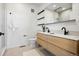 Modern bathroom with double vanity, sleek fixtures, and a walk-in shower at 1601 Park Ave # 216, Denver, CO 80218