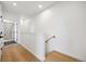 Modern light-filled stairwell with wooden floors and simple design at 1601 Park Ave # 216, Denver, CO 80218