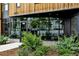 Building exterior with wood siding and large windows at 1601 Park Ave # 216, Denver, CO 80218