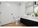 Modern bathroom with floating vanity, round sink, and black accents at 1601 Park Ave # 216, Denver, CO 80218