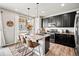 Island kitchen with granite countertops and pendant lighting at 2688 Loon Cir, Castle Rock, CO 80104