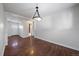 Simple dining room with hardwood floors and chandelier at 443 S Robb Way, Lakewood, CO 80226