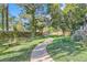 Curving path meanders through a well-maintained yard with lush greenery at 2227 Canyon Blvd # 253B, Boulder, CO 80302