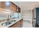Modern kitchen with granite countertops, stainless steel sink, and ample cabinetry at 2227 Canyon Blvd # 253B, Boulder, CO 80302
