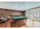 Basement recreation room with pool table, ping pong, and comfortable seating at 2227 Canyon Blvd # 253B, Boulder, CO 80302