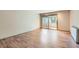Bright bedroom with hardwood floors and sliding glass door to balcony at 2227 Canyon Blvd # 253B, Boulder, CO 80302