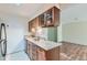 Kitchen with granite countertops and wood cabinets at 2227 Canyon Blvd # 253B, Boulder, CO 80302