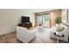 Living room with hardwood floors, and sliding glass door to balcony at 2227 Canyon Blvd # 253B, Boulder, CO 80302