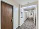 Clean and well-lit hallway with a carpeted floor and access to various rooms at 2227 Canyon Blvd # 253B, Boulder, CO 80302