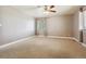 Bright bedroom with ceiling fan, neutral walls, and carpeted floors at 11685 Salem St, Henderson, CO 80640