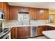 Kitchen with stainless steel appliances and wood cabinets at 11685 Salem St, Henderson, CO 80640
