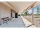 Long covered patio with a bench and views of the backyard at 11685 Salem St, Henderson, CO 80640