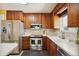 Kitchen with stainless steel appliances and wood cabinets at 11685 Salem St, Henderson, CO 80640