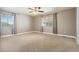 Bedroom with ceiling fan, neutral walls, and carpeted floors at 11685 Salem St, Henderson, CO 80640