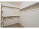 Walk-in closet with double hanging rods and shelving at 11685 Salem St, Henderson, CO 80640