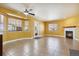 Spacious living room with tile floors, fireplace and large windows at 11685 Salem St, Henderson, CO 80640