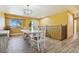 Bright dining room with tile floors and a view into the kitchen at 11685 Salem St, Henderson, CO 80640