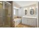 Bathroom with double vanity, soaking tub, and shower at 11685 Salem St, Henderson, CO 80640