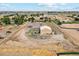 Aerial view of property featuring a house, detached shop, and ample land at 11685 Salem St, Henderson, CO 80640