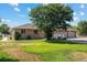 House exterior on a sunny day with a three car garage and a landscaped yard at 11685 Salem St, Henderson, CO 80640
