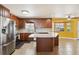 Kitchen with stainless steel appliances and an island at 11685 Salem St, Henderson, CO 80640