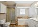 Main bathroom with a shower/tub combo and double sinks at 11685 Salem St, Henderson, CO 80640