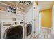 Laundry room with washer, dryer, and shelving at 11685 Salem St, Henderson, CO 80640