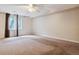 Carpeted bedroom with window, ceiling fan and ample space at 11685 Salem St, Henderson, CO 80640