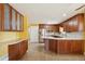 Kitchen with wood cabinets, stainless steel appliances and large island at 11685 Salem St, Henderson, CO 80640
