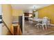Entryway with staircase, view of dining area, and kitchen at 11685 Salem St, Henderson, CO 80640