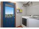 Laundry room with washer, dryer, and a door leading outside at 36023 Winchester Rd, Elizabeth, CO 80107