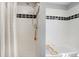 Bathroom with shower/tub combo and a white tile surround at 36023 Winchester Rd, Elizabeth, CO 80107