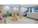 Finished basement with play area, exercise equipment, and a sitting area at 36023 Winchester Rd, Elizabeth, CO 80107