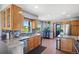 Kitchen boasts granite countertops, stainless steel appliances, and wood cabinets at 36023 Winchester Rd, Elizabeth, CO 80107